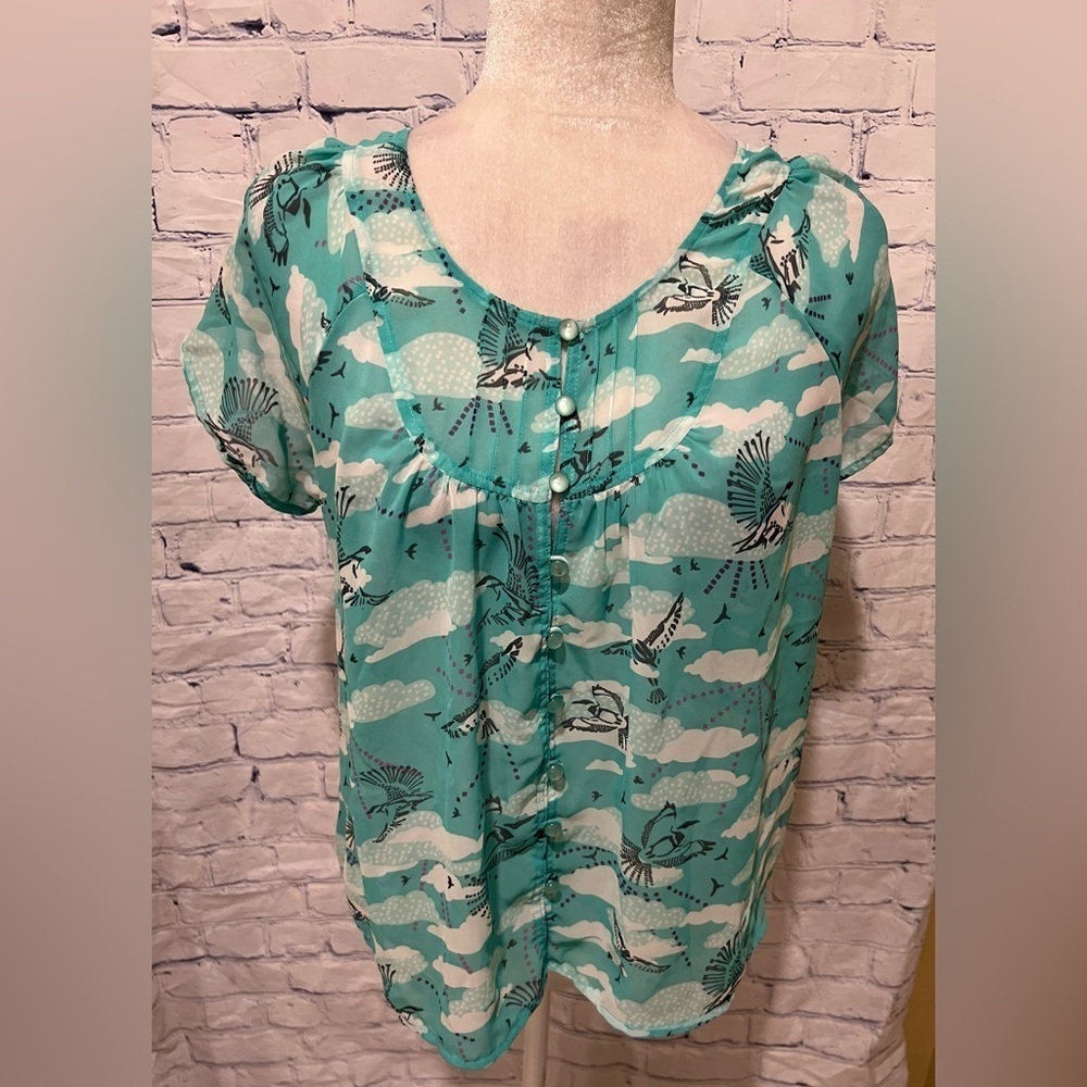 Kirra Sheer shirt Light blue with bird design And Buttons up front. Small